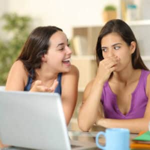 Woman with bad breath talking to friend Bad Breath: Causes, Myths, and Real Solutions