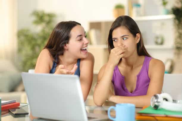 Woman with bad breath talking to friend Bad Breath: Causes, Myths, and Real Solutions